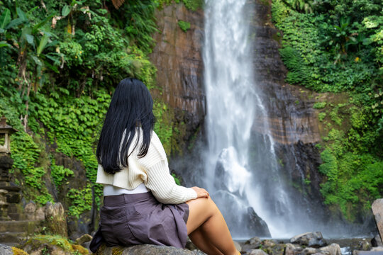 Rear view of a woman at Gitgit waterfall in Bali , Singaraja, Indonesia