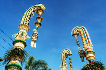 Balinese penjor against blue sky in Desa Munggu Bali Indonesia