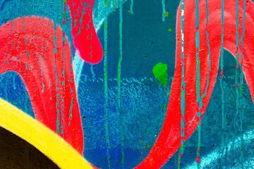 Vibrant abstract graffiti with neon red and blue. 80s street art style, paint drips, bold colors. Urban walls, edgy visuals, modern 90s, 2000s design, creative poster, digital artwork.