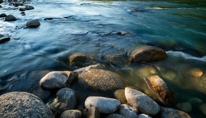 Fototapeta premium Clear Water Over Smooth River Rocks