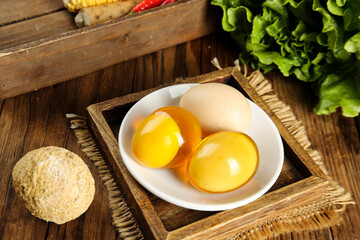 Fresh Farm Eggs with Golden Yolks on Rustic Wooden Table - Healthy Cooking Ingredients