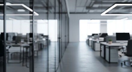 Fototapeta premium Contemporary blurred office space with glass partitions and workstations