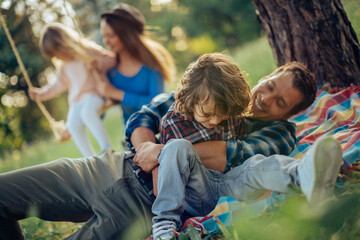 Young family having a picnic in the park