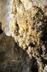 Inside of beautiful old dark cave with many stalactites. Grotte di Is Zuddas, Italy, Sardinia