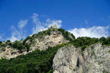 Fototapeta premium Buildings on top of a mountain and blue sky