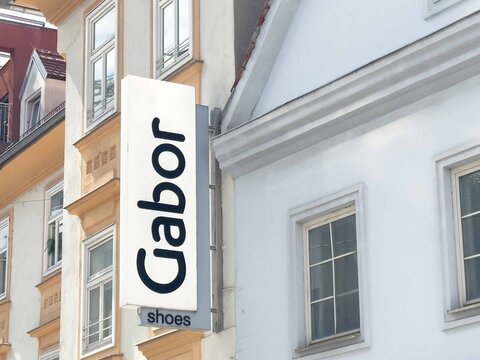 Graz, Austria - September 06, 2025: Gabor shoes storefront sign displayed prominently on a building exterior, showcasing brand identity and urban architecture in a vibrant city setting