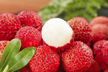 Fresh Hainan Lychee Fruits with Red Textured Skin and White Flesh Close-up