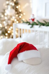 Fototapeta premium Cozy holiday scene with santa hat on knit blanket amid warm christmas lights