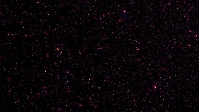 Abstract animation loop glow pink stars particles flow down on black background. 4K 3D seamless looping gold bokeh particles dust fly in the air.