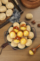 Golden Tea Eggs with Cracked Shells in Cast Iron Pan - Traditional Asian Cuisine