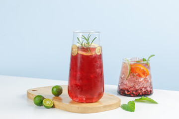 Fresh Summer Grape Cocktails with Herbs and Citrus on Wooden Table Scene