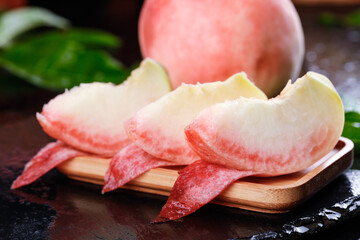Fresh Yangshan Peach Slices on Wooden Board - Summer Fruit Close-up