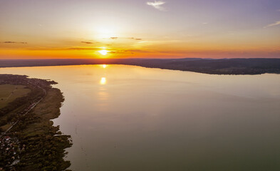 Spectacular sunset over lake Balaton with golden reflections, Hungary.