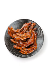 Marinated Duck Feet in Brown Sauce on Traditional Ceramic Plate White Background