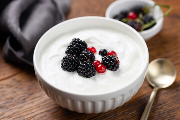 Super healthy bowl of thick greek yogurt and fresh berries, rich in Protein and Calcium diet dessert
