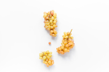 Many fresh green grape clusters isolated on white background.