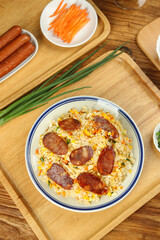 Homemade Fried Rice with Sausage and Vegetables on Wooden Serving Tray - Asian Cuisine Cooking