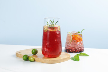 Fresh Summer Cocktails with Herbs and Citrus on Wooden Board - Refreshing Cold Drinks for Hot Weather