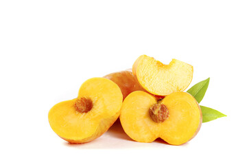 Fresh Ripe Peaches Sliced and Whole with Leaves on White Background