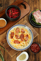 Fried Rice with Sausage on Wooden Table - Asian Cuisine Ingredients and Spices