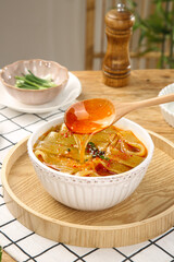 Sweet Potato Noodles with Hot Streaming Sauce Cooking Demonstration in Kitchen Setting