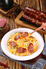 Fried Rice with Sausage in Bowl on Wooden Table - Traditional Asian Cuisine