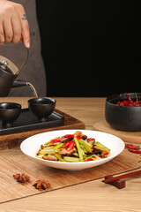 Sautéed Celery with Bacon and Red Peppers on White Plate with Tea Service