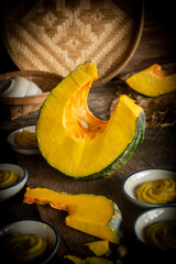Thai dessert: steamed pumpkin flower-shaped dessert served in a Thai-style cup
