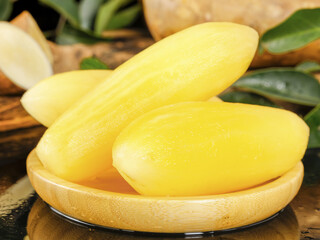 Fresh Mango Slices in Wooden Bowl - Tropical Fruit on Rustic Kitchen Table