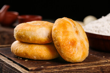 Traditional Five-Kernel Mooncakes for Mid-Autumn Festival on Rustic Wooden Background