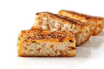 Hard, aged cheese with a rough texture and a golden yellow color