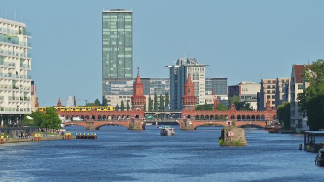 Oberbaumbrucke crossing the River Spree in Berlin on a clear sunny day - Germany