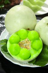 Fresh Honeydew Melon Balls in Carved Melon Bowl - Healthy Organic Fruit Presentation