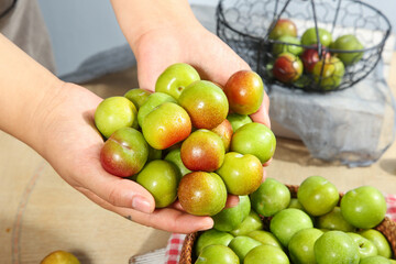 Fresh Organic Plums in Hands - Healthy Natural Fruit Harvest Kitchen Scene