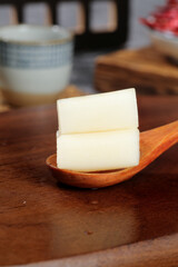 Fresh Lotus Root Slices on Wooden Spoon - Asian Vegetable Ingredient