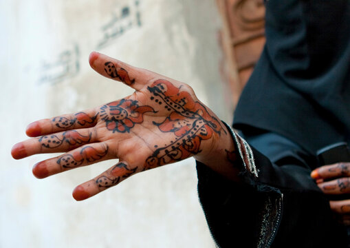 Somali refugee showing her hands tattooed with henna, Mecca province, Jeddah, Saudi Arabia