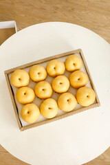 Premium Laiyang Moon Pears in Wooden Gift Box on White Table - Fresh Autumn Fruit Arrangement