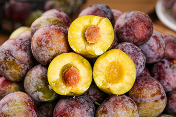 Freshly Picked Red Plums with Golden Yellow Flesh - Ripe Stone Fruit