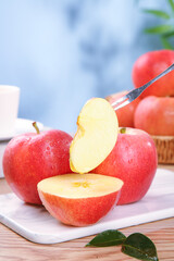 Fresh Red Fuji Apples from Xinjiang Aksu with Knife on Cutting Board