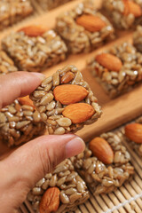 Obraz premium Handmade Nut Seed Brittle with Almonds Sunflower Seeds Traditional Homemade Candy Snack