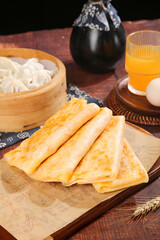 Handmade Potato Pancakes with Shredded Filling and Steamed Dumplings Traditional Breakfast Setup
