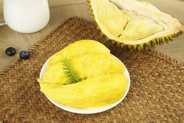 Fresh Thai Durian Fruit with Golden Flesh on Plate - Exotic Tropical Asian Cuisine