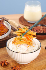 Spicy Shredded Chicken Over Rice Bowl with Korean Side Dishes and Chopsticks on Wooden Table