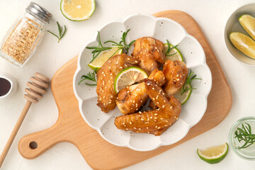 Honey Lemon Glazed Chicken Wings with Sesame and Lime.