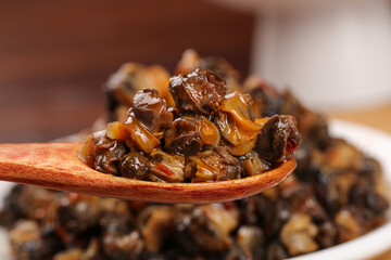 French Escargot Snails in Garlic Butter on Wooden Spoon - Traditional Gourmet Delicacy