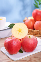 Fresh Red Gala Fuji Apples from Shaanxi China on White Plate with Wicker Basket