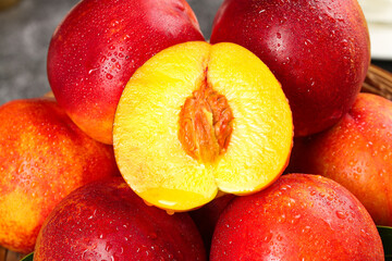 Fresh Red-Skinned Nectarines with Yellow Flesh and Water Droplets