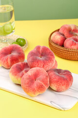 Fresh Flat Peaches with Red and Cream Skin on Cutting Board - Healthy Summer Fruit Display