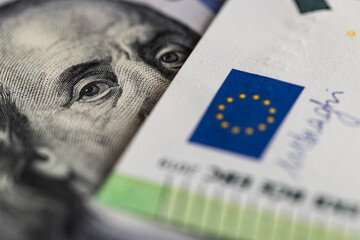 US Dollar and Euro banknotes close-up