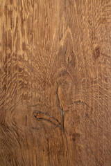 Brown oak wood texture with crack and wavy veins pattern, abstract natural backdrop